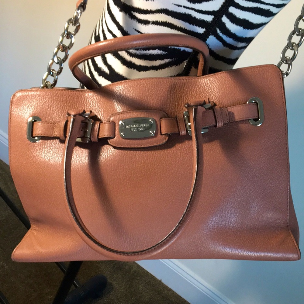 MK Tan leather satchel bag with shoulder strap.